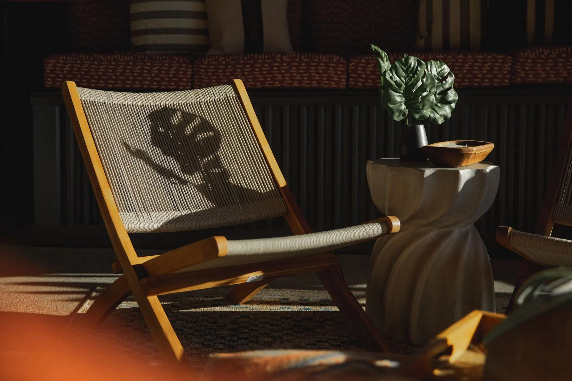 Pair of lounge chairs styled with a side table and soft textures in a refined living space