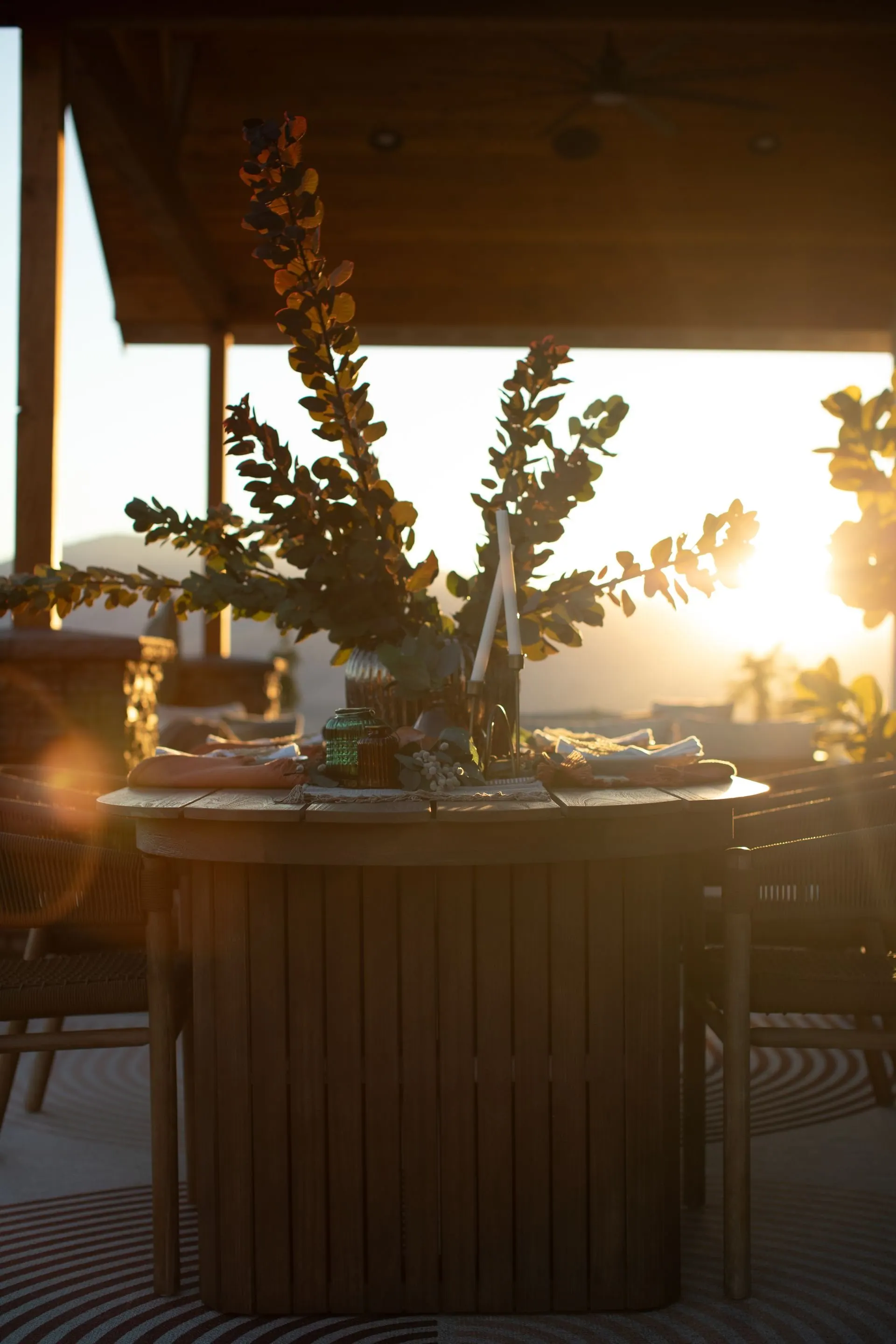 Outdoor dining table set at sunset overlooking the mountains at a Pacific Northwest home