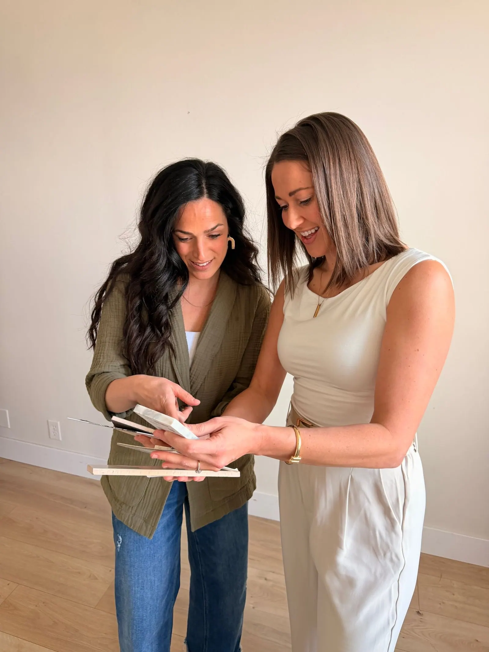 Dwelling Design team reviewing interior design materials and project selections together